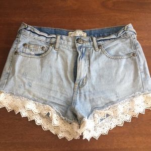 Free People denim shorts with lace trim